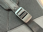 Louis Vuitton leather tag on perforated panel, dark teal