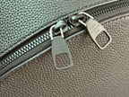Leather zipper pulls with Louis Vuitton markings, dark teal