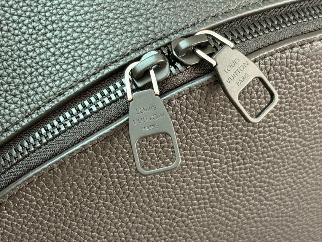 Leather zipper pulls with Louis Vuitton markings, dark teal