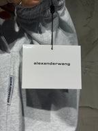 Heather-gray sweatpants with alexanderwang hang tag attached to the waistband.