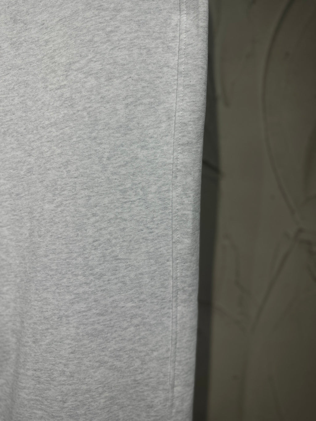 Heather-gray pant front with stitched seam and clean straight-leg silhouette.
