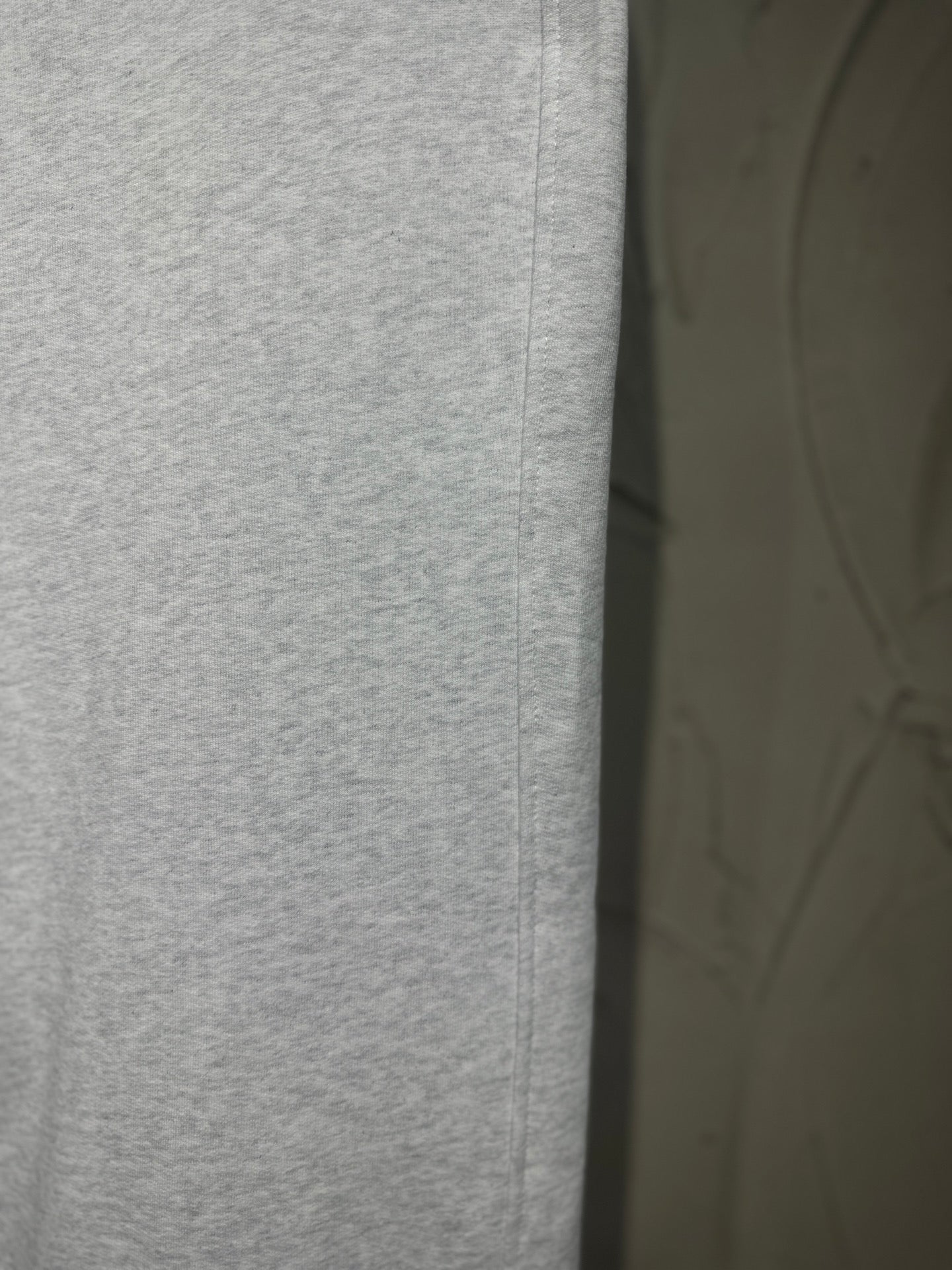 Heather-gray pant front with stitched seam and clean straight-leg silhouette.