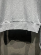 Light gray sweatshirt sleeve hem with ribbed cuff and curved bottom