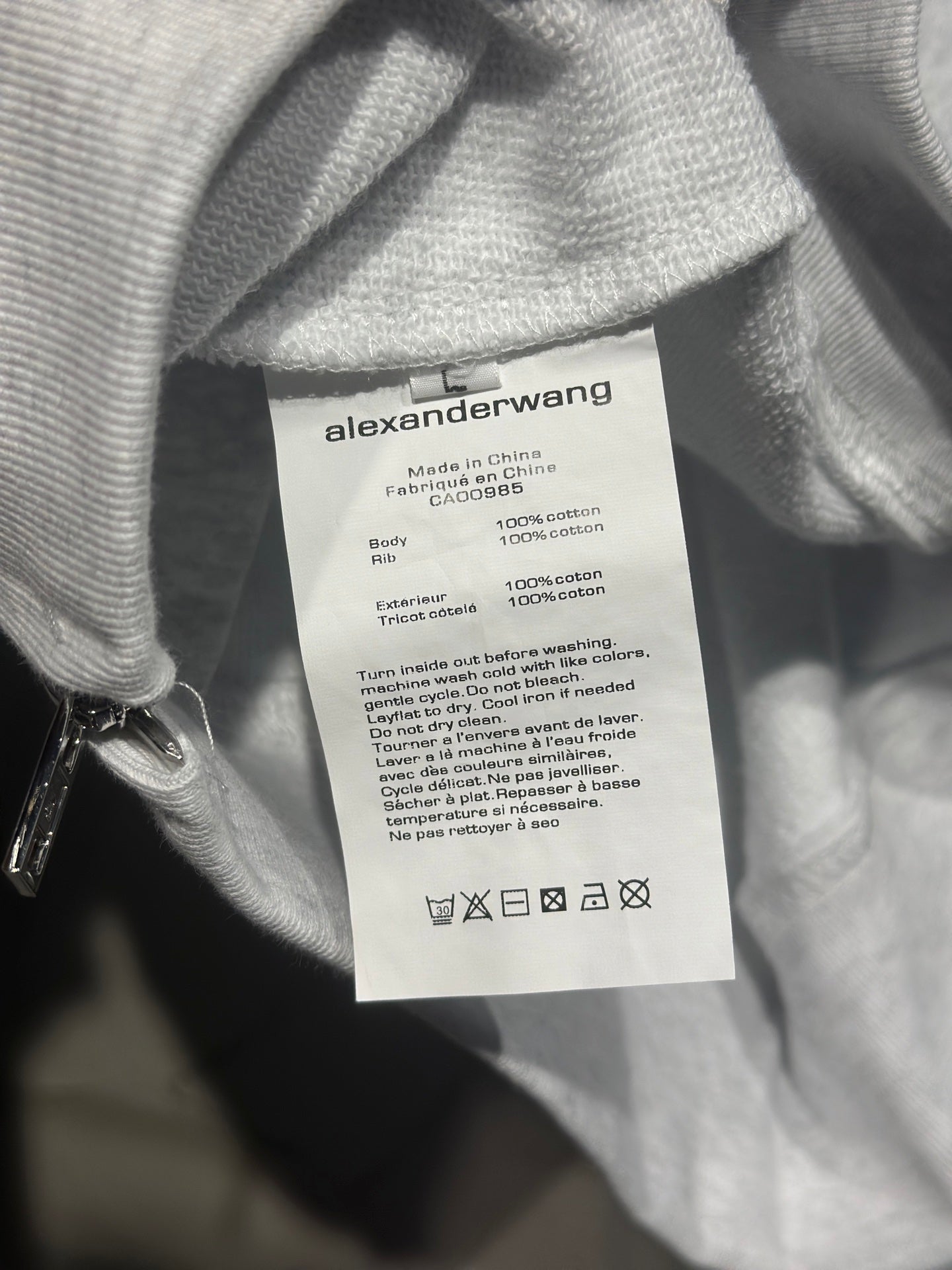 Light gray long-sleeve sweatshirt with alexanderwang care label