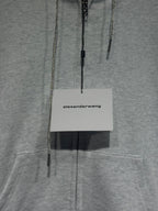Light gray hoodie with dangling zipper pulls and white alexanderwang hang tag
