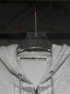 Light gray hoodie neckline with alexanderwang logo label and drawstring hood
