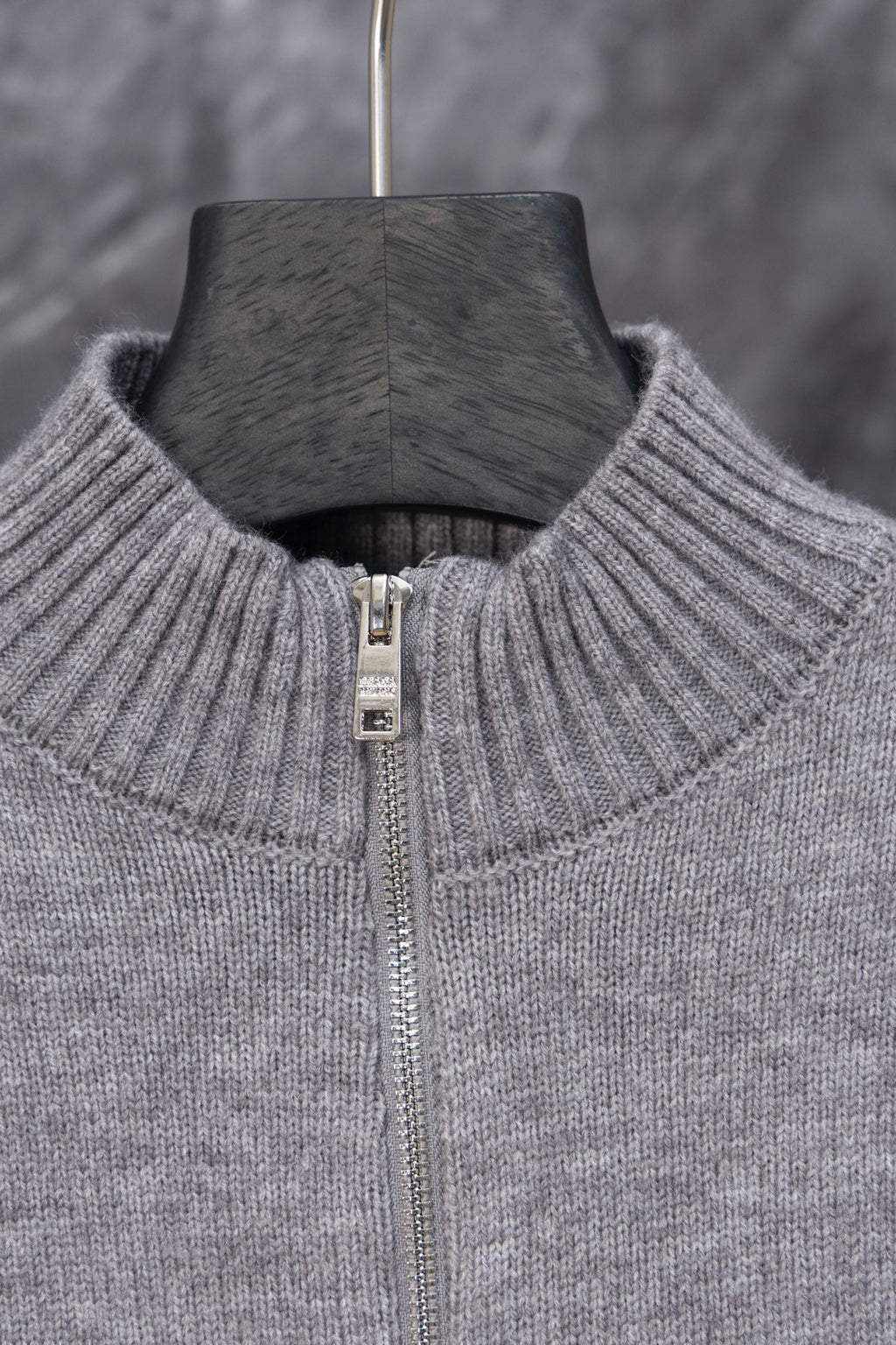 Gray Prada knit sweater neckline close-up with full-length zipper and ribbed collar