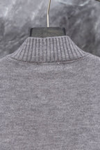 Gray Prada knit sweater with ribbed turtleneck collar, upper back view