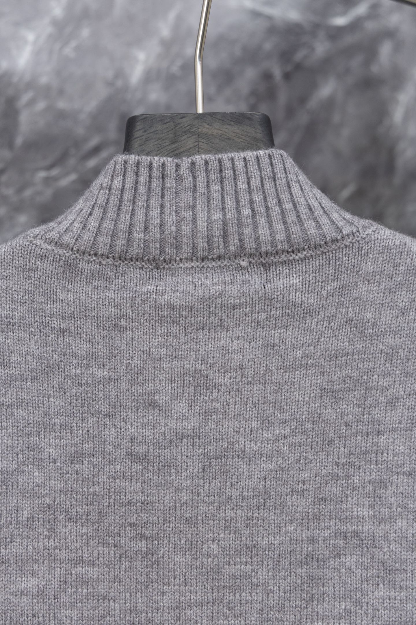 Gray Prada knit sweater with ribbed turtleneck collar, upper back view