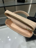 Cream leather bag interior view with zippered compartment and gold zipper trim