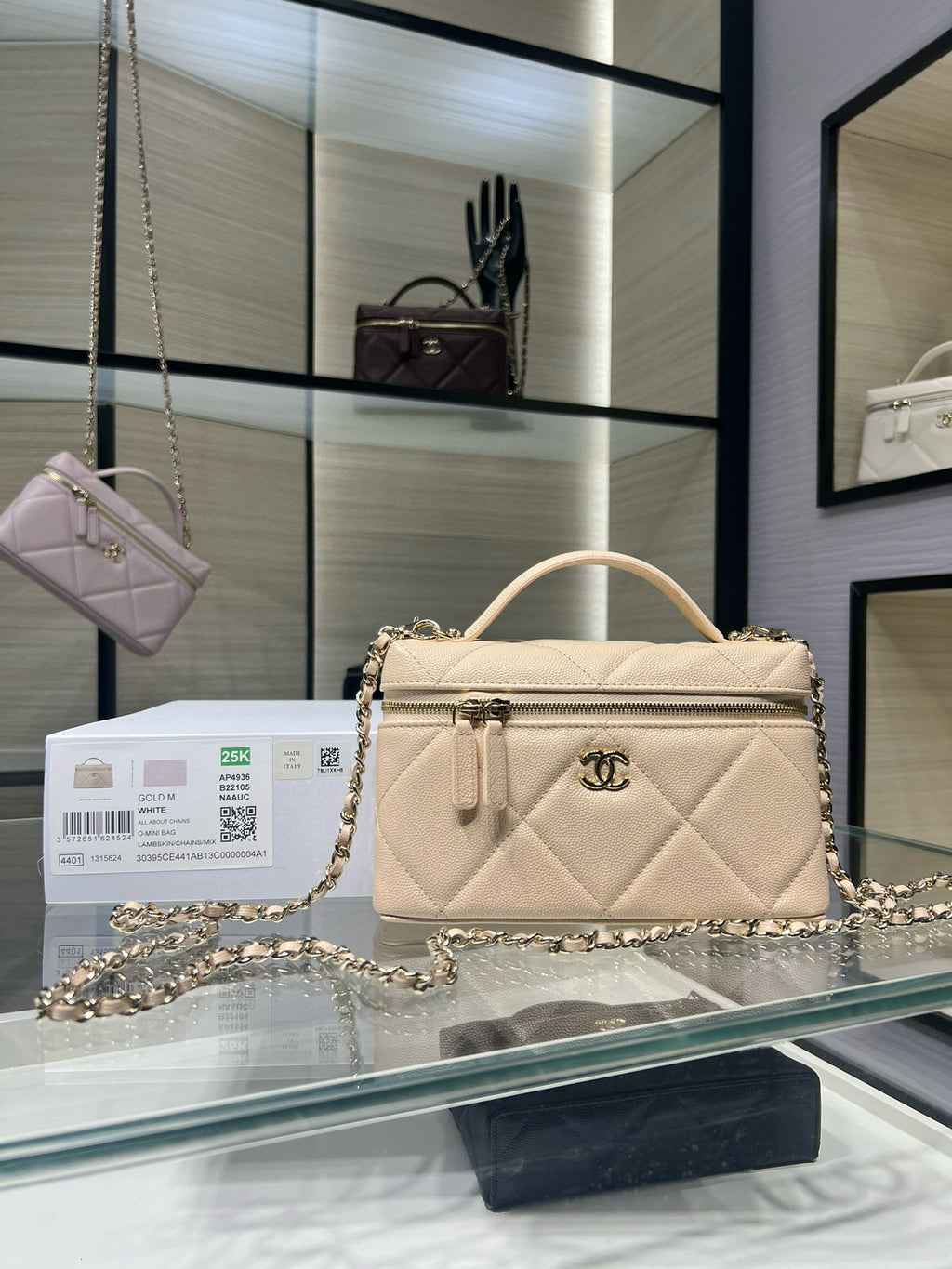 Cream quilted leather shoulder bag with gold chain strap and top handle