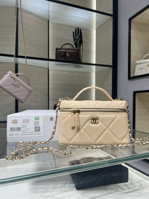 Cream quilted leather shoulder bag with gold chain strap and top handle