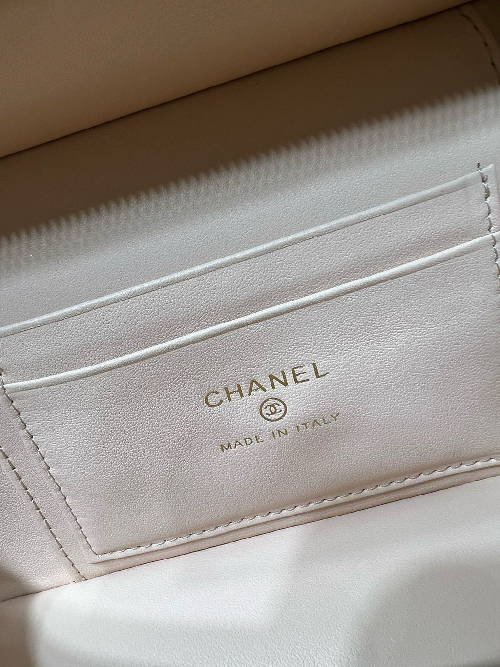 Cream leather interior label with CHANEL text and MADE IN ITALY