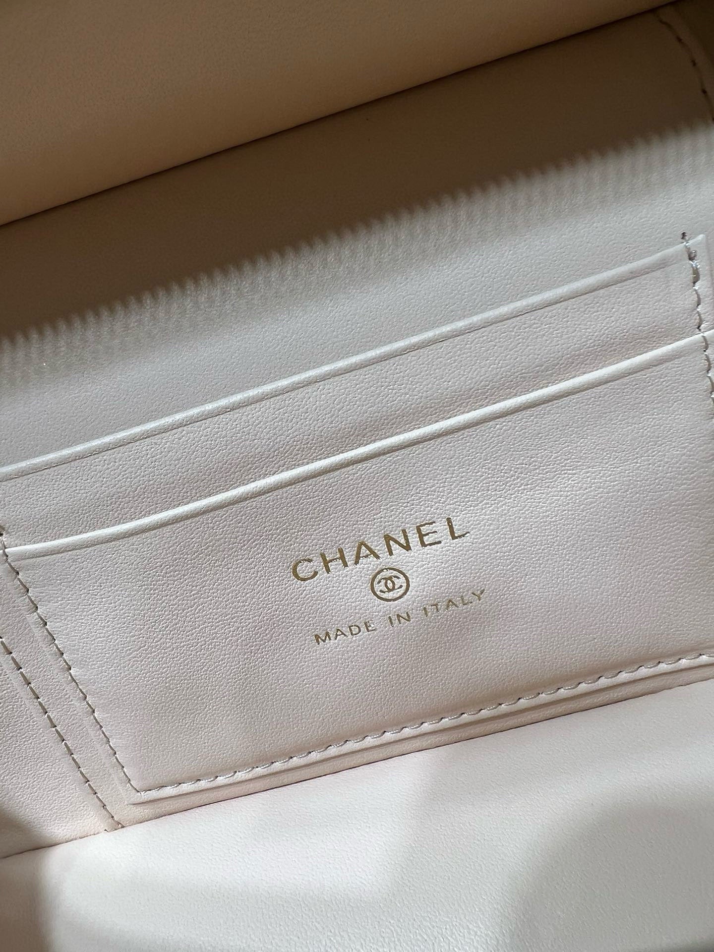 Cream leather interior label with CHANEL text and MADE IN ITALY