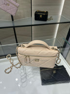 Cream quilted crossbody bag with gold chain strap and zippered front pocket