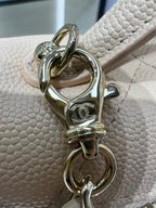 Cream leather handbag clasp with gold-toned ring and chain attachment hardware