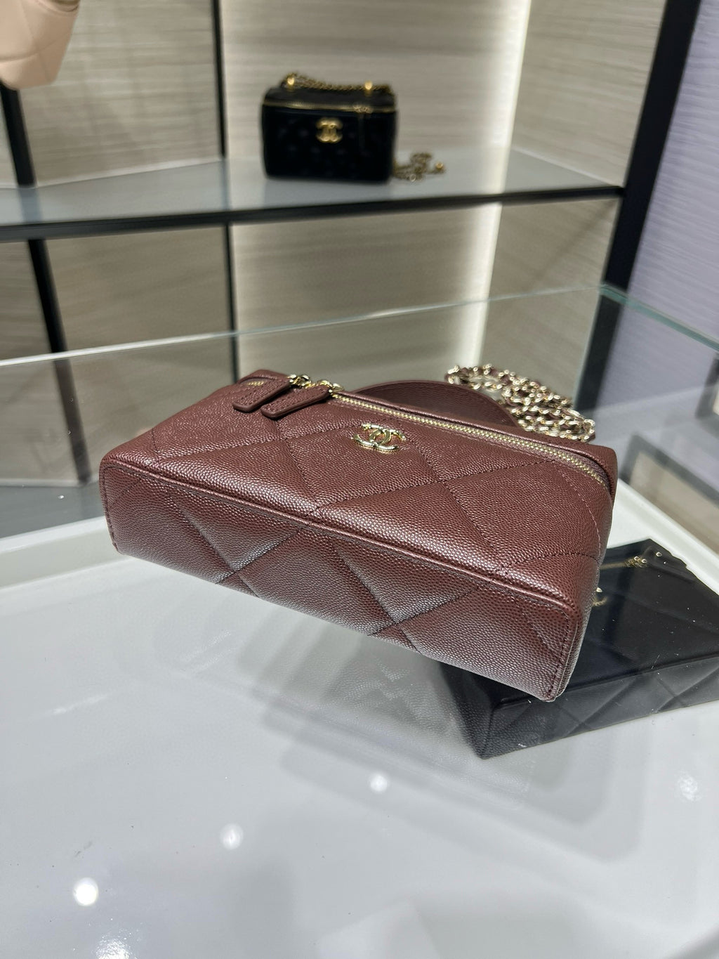 Chanel burgundy quilted mini bag with gold-tone CC clasp and chain strap