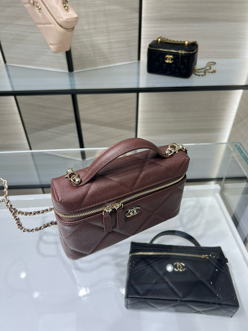 Chanel burgundy mini shoulder bag with chain strap and front zipper pocket