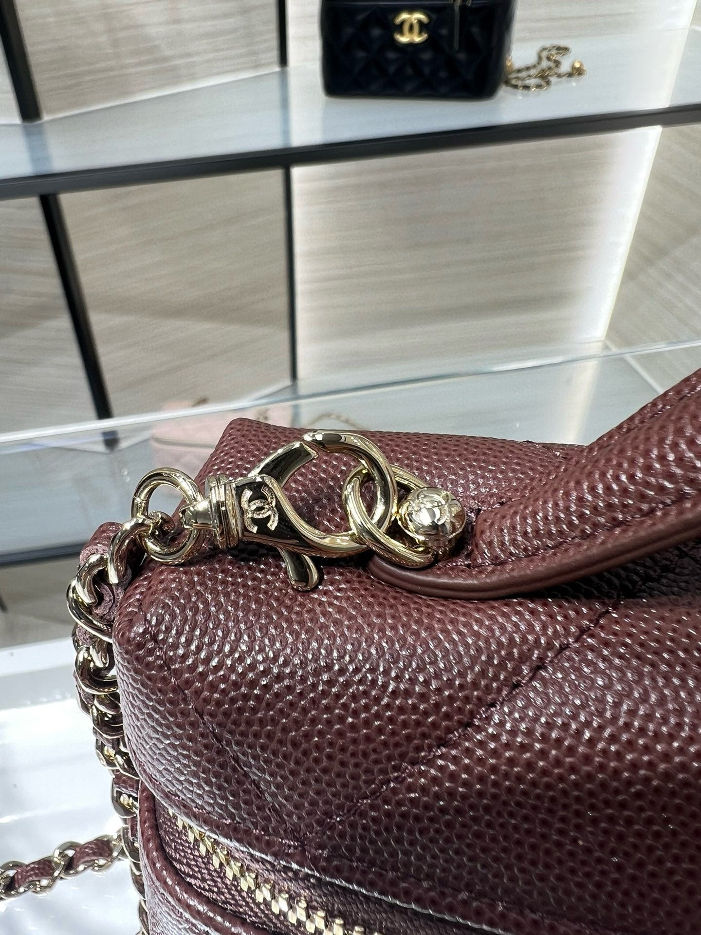 Chanel burgundy quilted mini bag with gold-tone chain and CC clasp detail