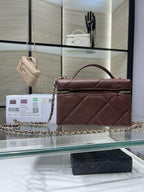Chanel burgundy quilted mini bag with top handle and chain shoulder strap