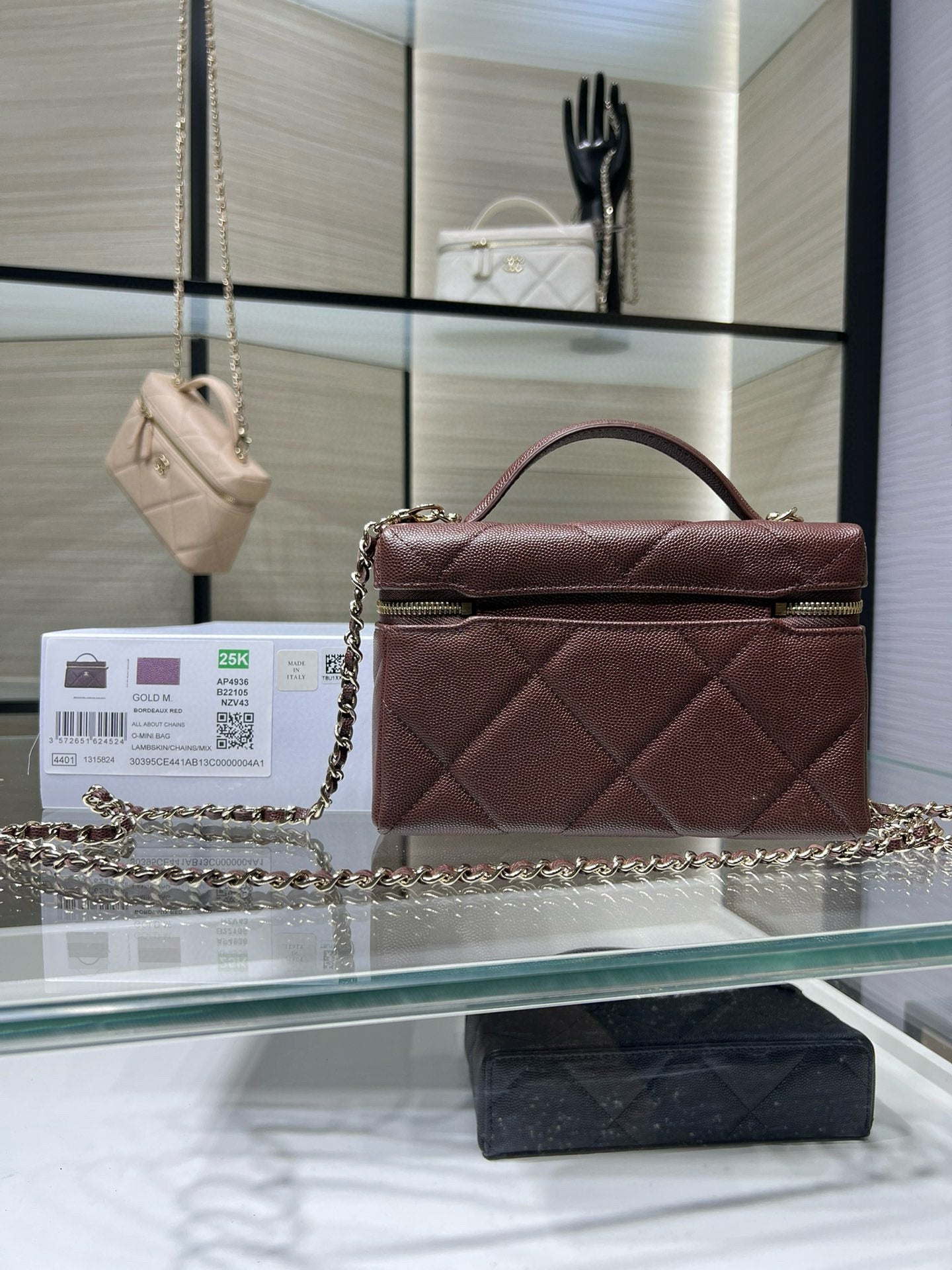 Chanel burgundy quilted mini bag with top handle and chain shoulder strap