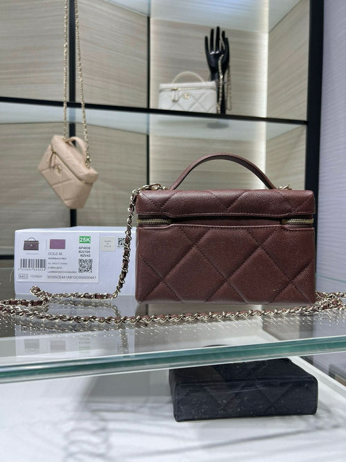 Chanel burgundy quilted mini bag with top handle and chain shoulder strap