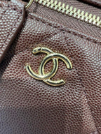 Chanel burgundy textured leather with gold-tone CC logo on front