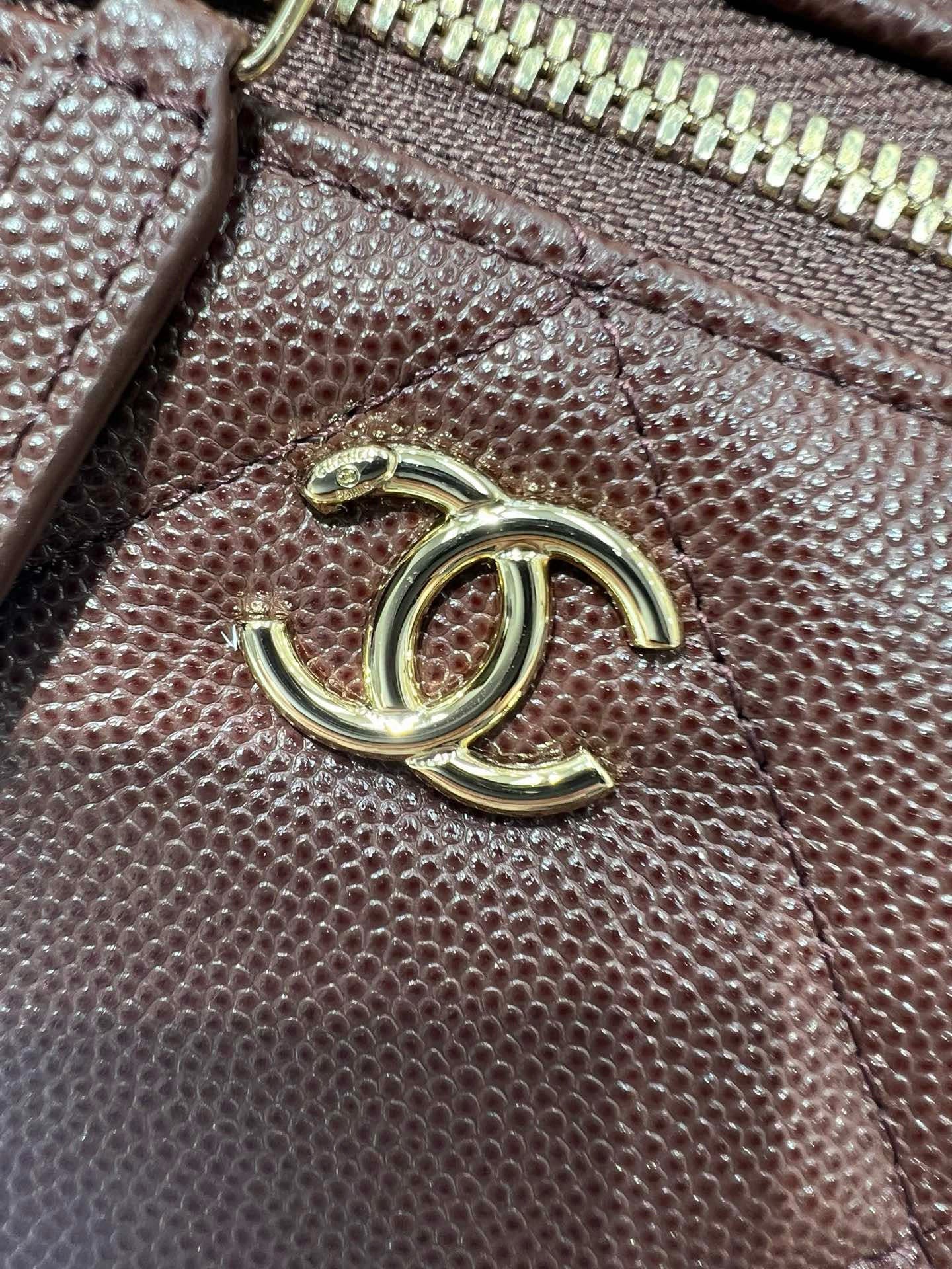 Chanel burgundy textured leather with gold-tone CC logo on front