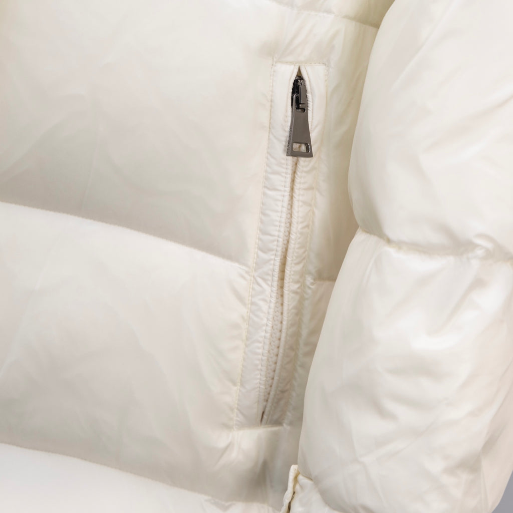 Moncler long puffer coat, cream zipper placket close-up