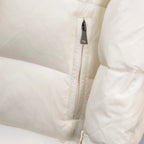 Moncler long puffer coat, cream zipper placket close-up