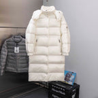 Long white puffer jacket with hood and zip front, snap details and side pockets
