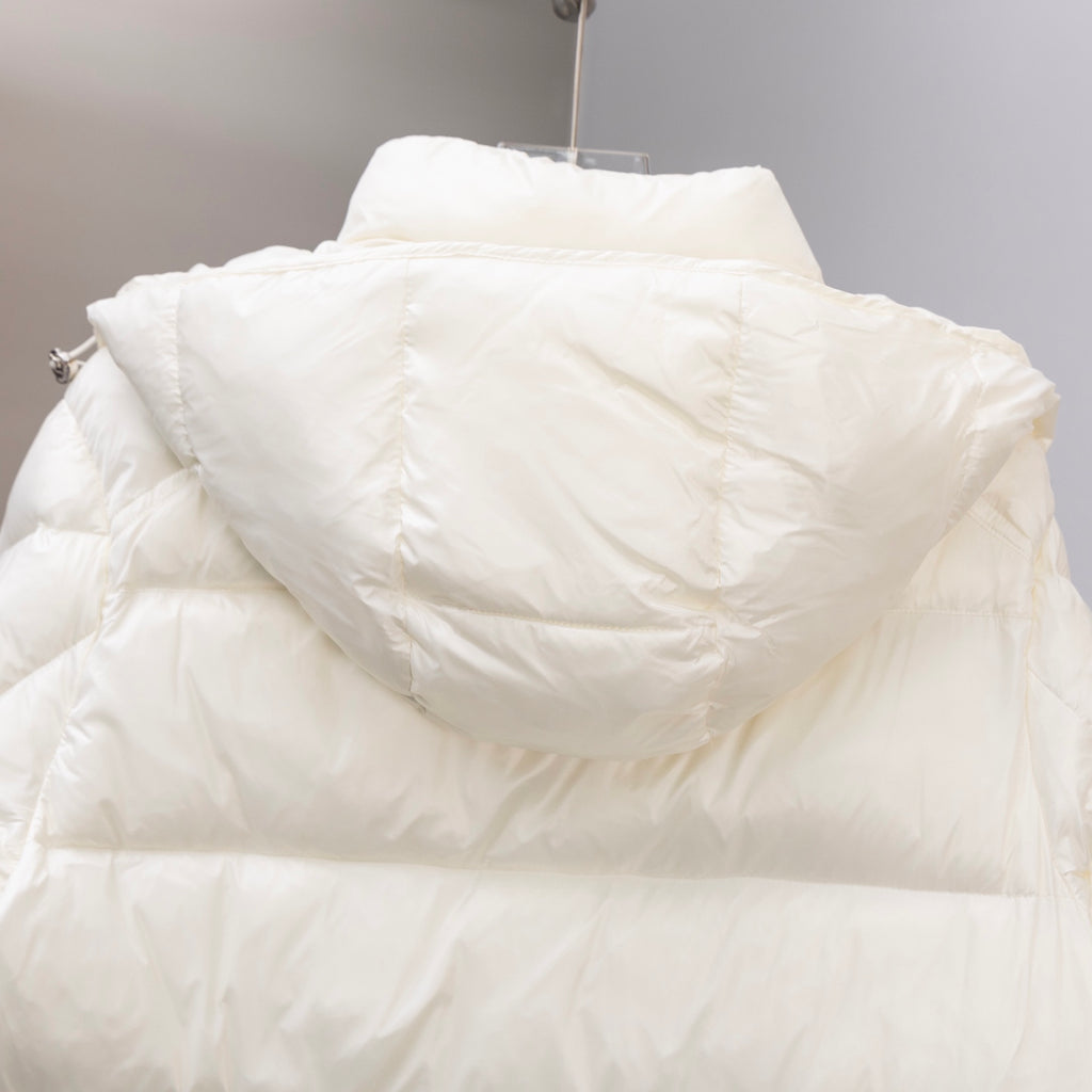 White long puffer jacket with hood, back view showing quilted panels