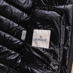 Black puffer jacket fabric label on quilted lining under front flap