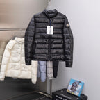 Long black puffer jacket with stand collar, full front zipper, quilted panels