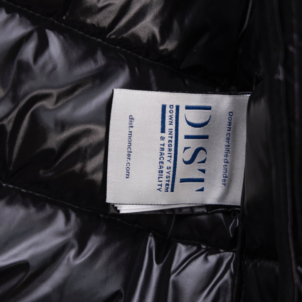 Black puffer jacket fabric label on quilted interior panel