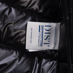 Black puffer jacket fabric label on quilted interior panel
