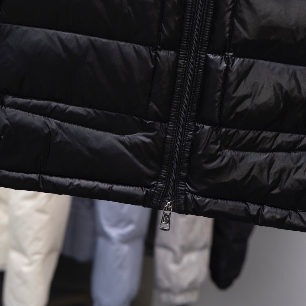 Moncler long puffer jacket, dark quilted fabric with front zipper and padded panels