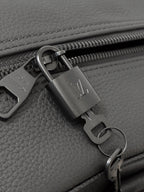 Dark gray leather zipper pull with lock charm and metal ring