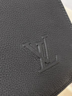 Dark gray leather with embossed logo on corner