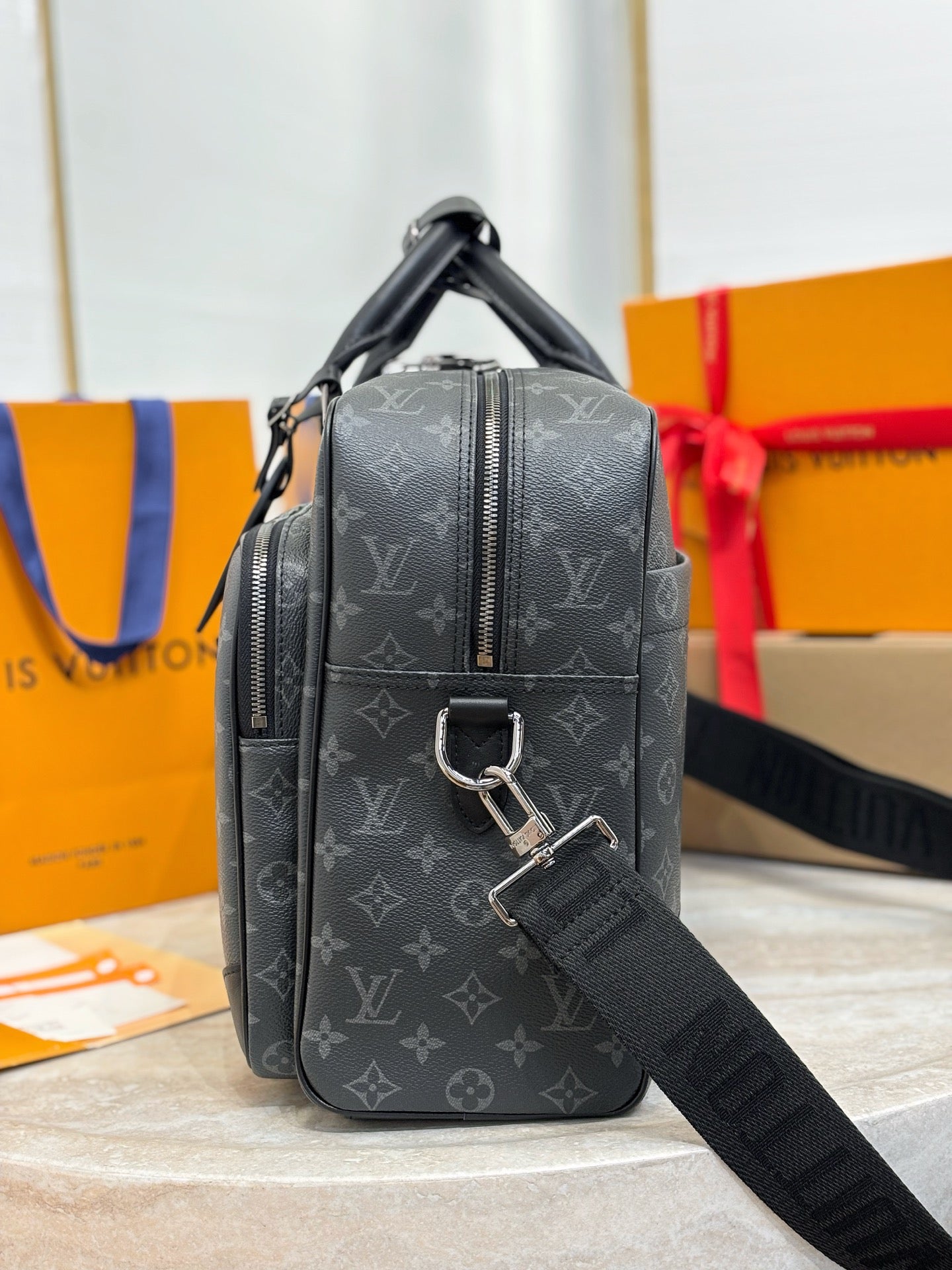 Men's Louis Vuitton monogram crossbody bag with front zipper and adjustable strap