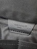 Louis Vuitton black leather interior label with embossed logo