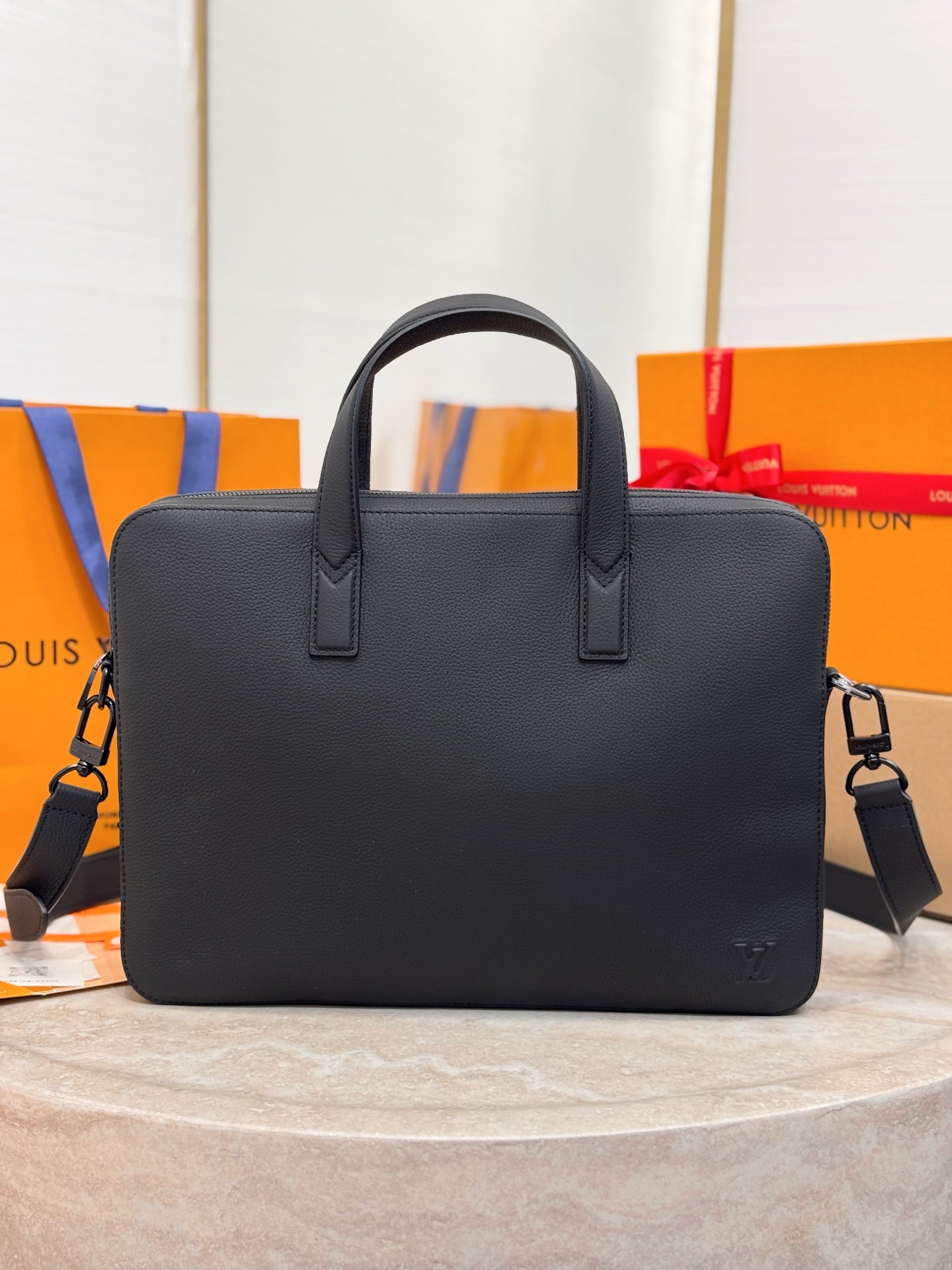 Louis Vuitton men’s leather tote bag, black, top handles and adjustable shoulder strap