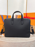 Louis Vuitton black leather handbag with top handles and crossbody strap