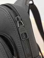 Louis Vuitton black leather bag with engraved zipper pull and track