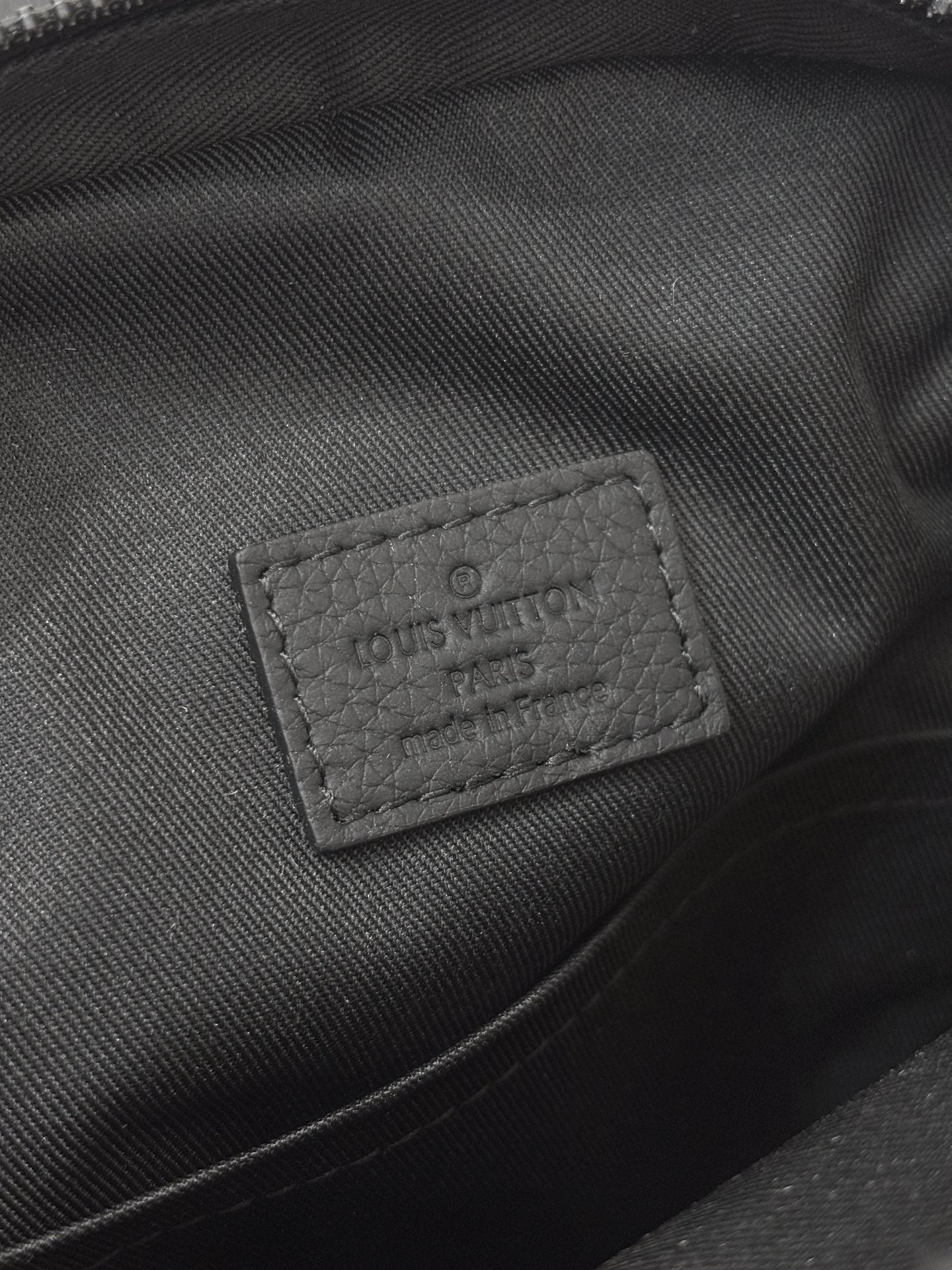 Louis Vuitton black fabric lining with stitched Louis Vuitton Paris label