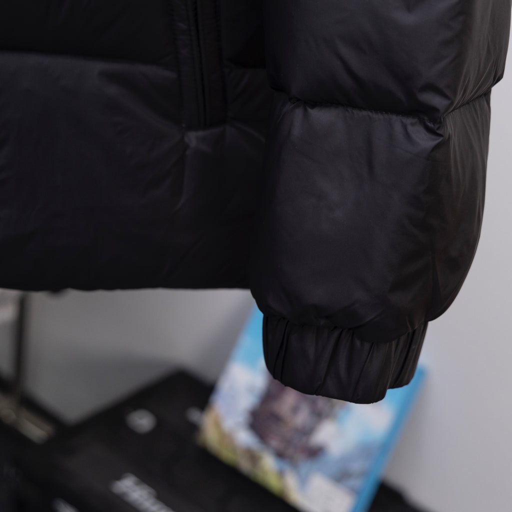 Moncler long coat elastic cuff and dark padded shoulder detail