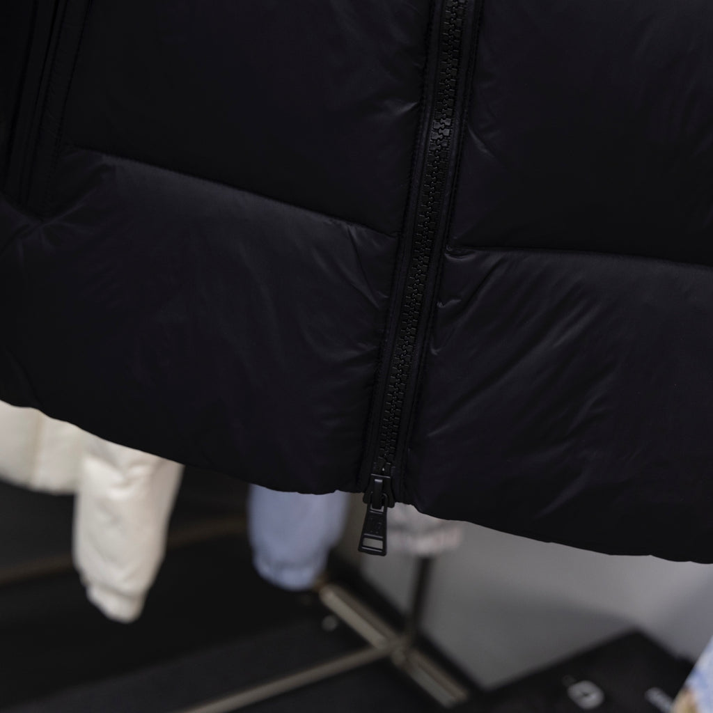 Moncler long coat front zipper and dark padded fabric detail