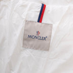 Moncler logo patch with red, white, and blue stripe on white fabric