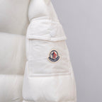 White Moncler puffer jacket sleeve with round Moncler logo patch