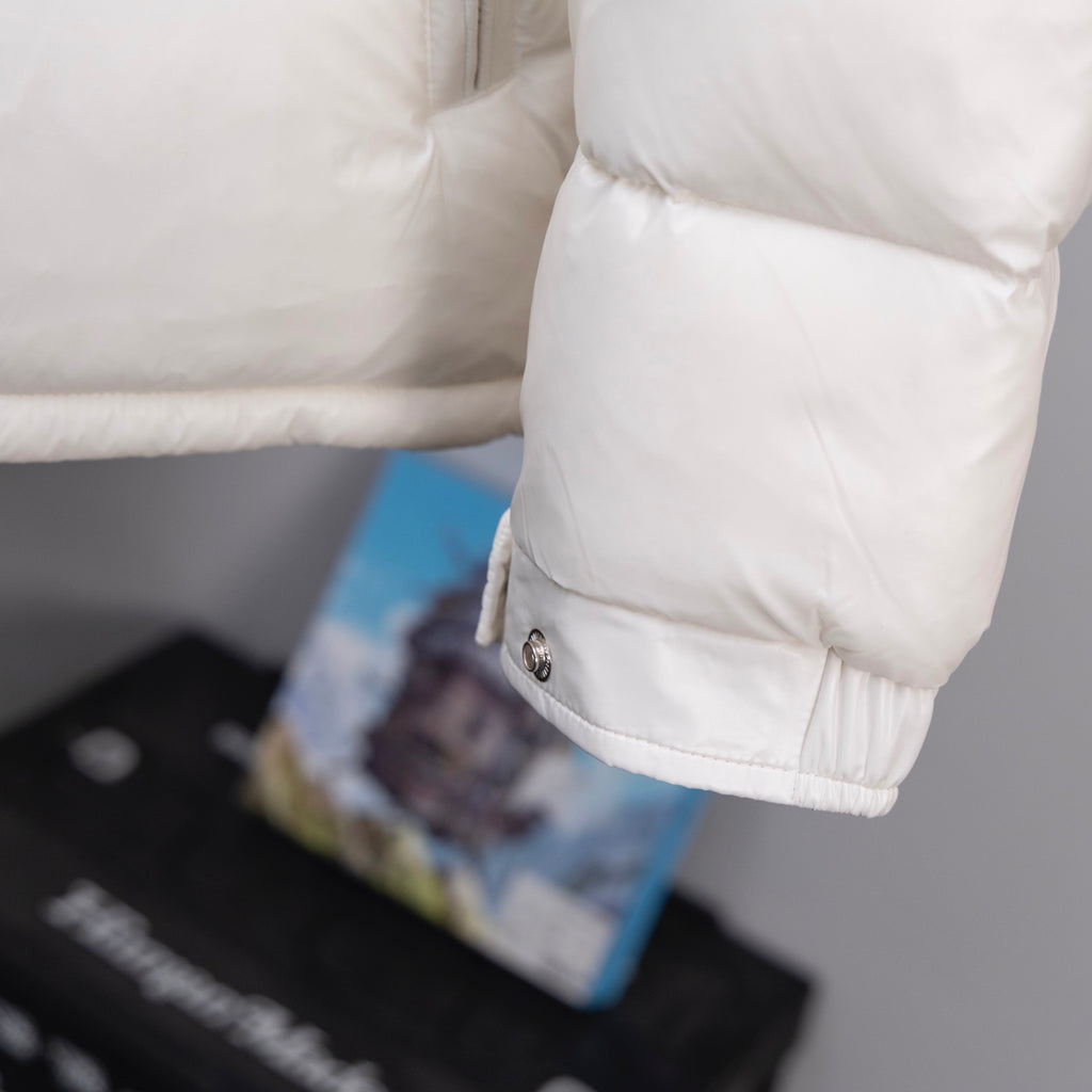 Long Moncler down jacket sleeve cuff with logo patch